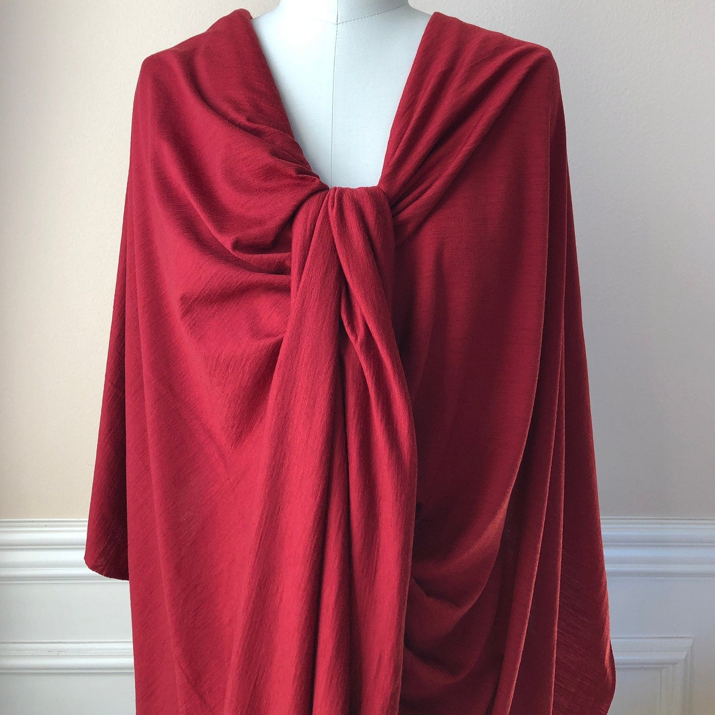 Artistically styled soft merino wool jersey on dress form.