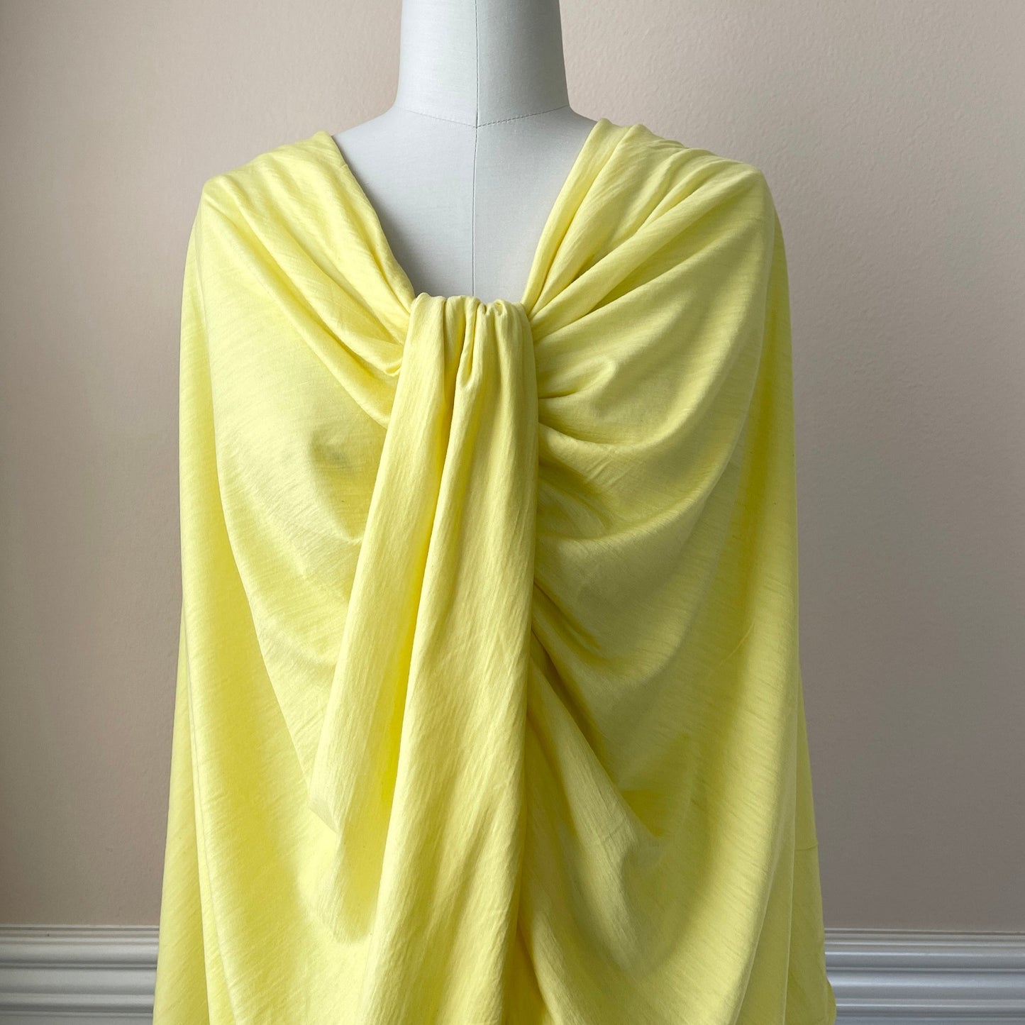 Dress form used to present soft merino wool fabric.
