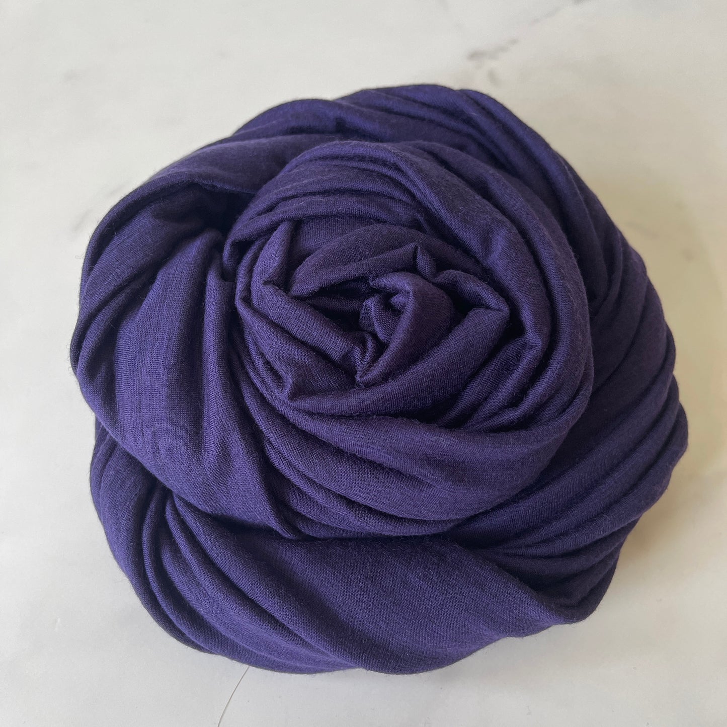 Innovative yarn dyed merino wool in heather black and blue color.