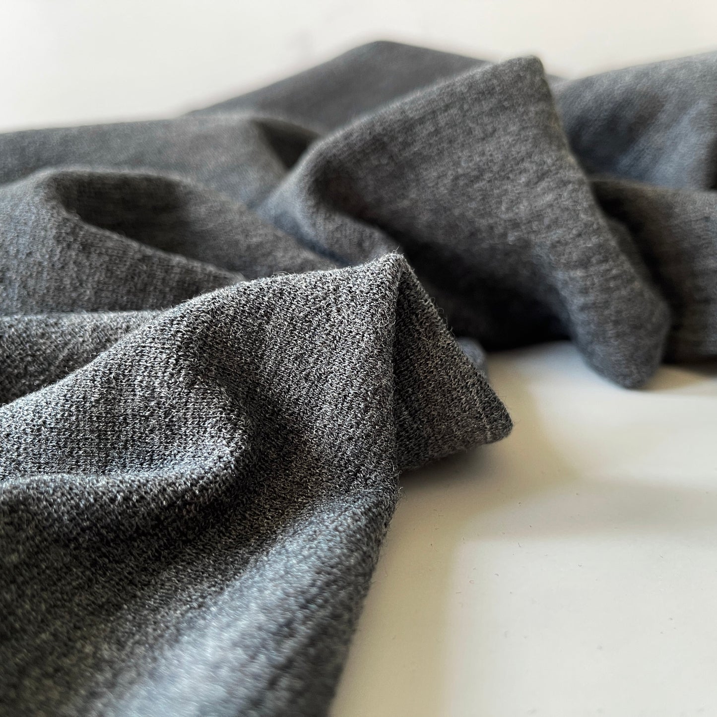 Close view of merino wool fabric showing textile surface.