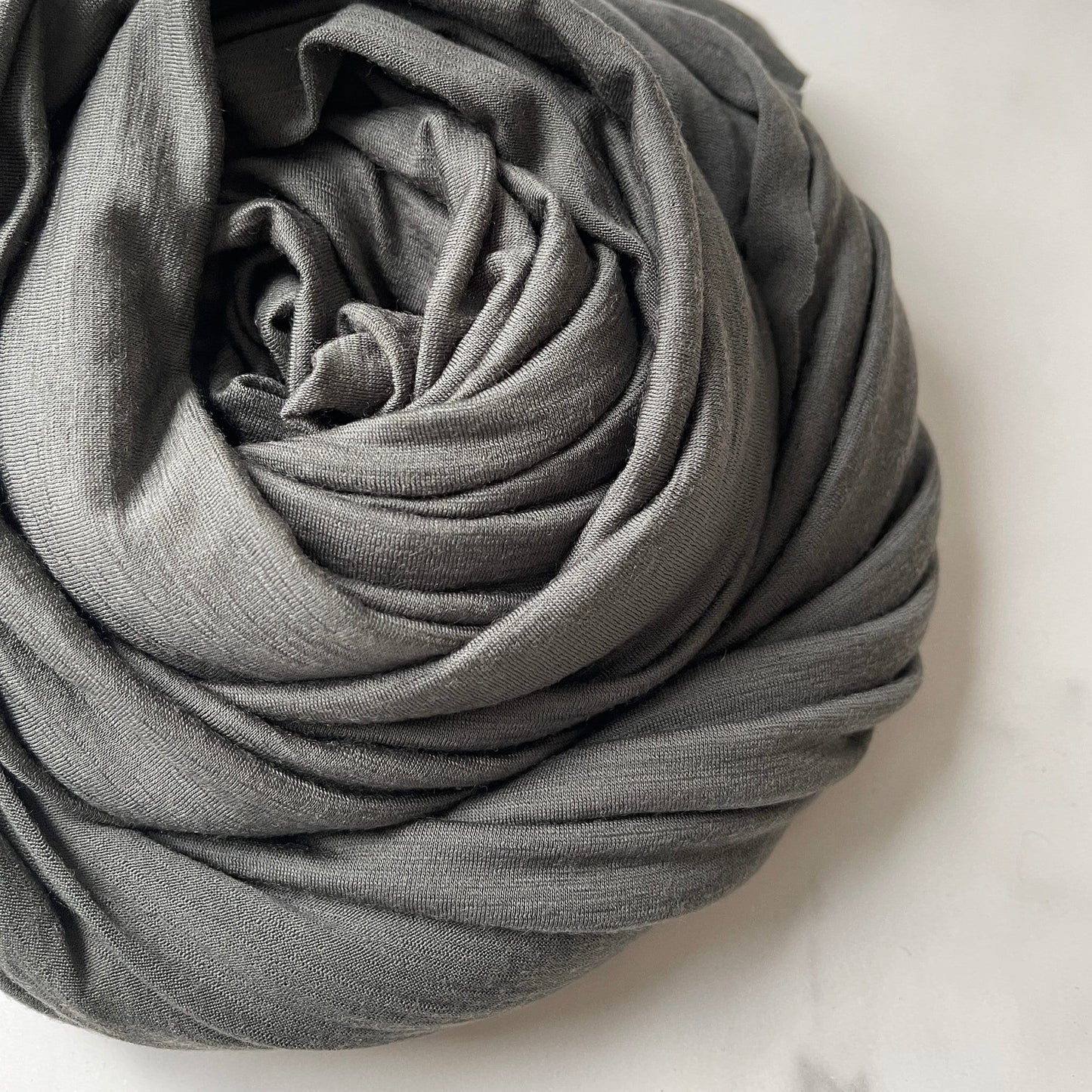 Merino wool's natural luster under daytime natural light.