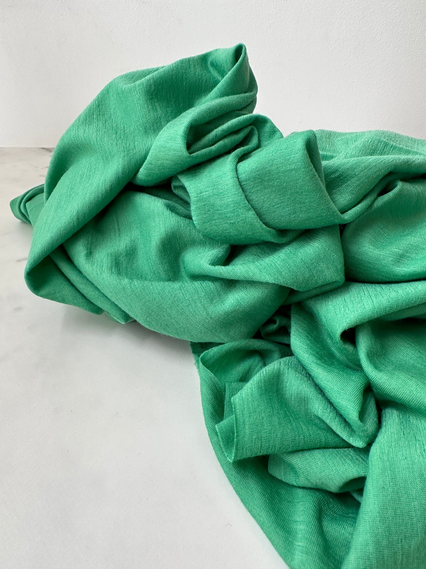 Natural luster of sustainable merino wool fabric.