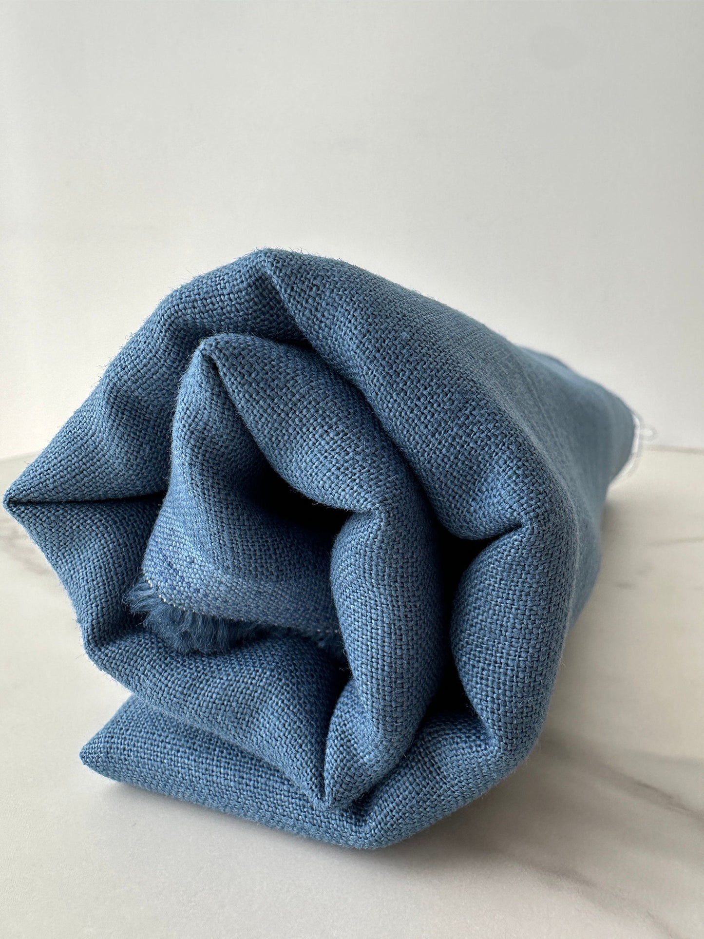 aegean blue linen fabric close up woven texture detail