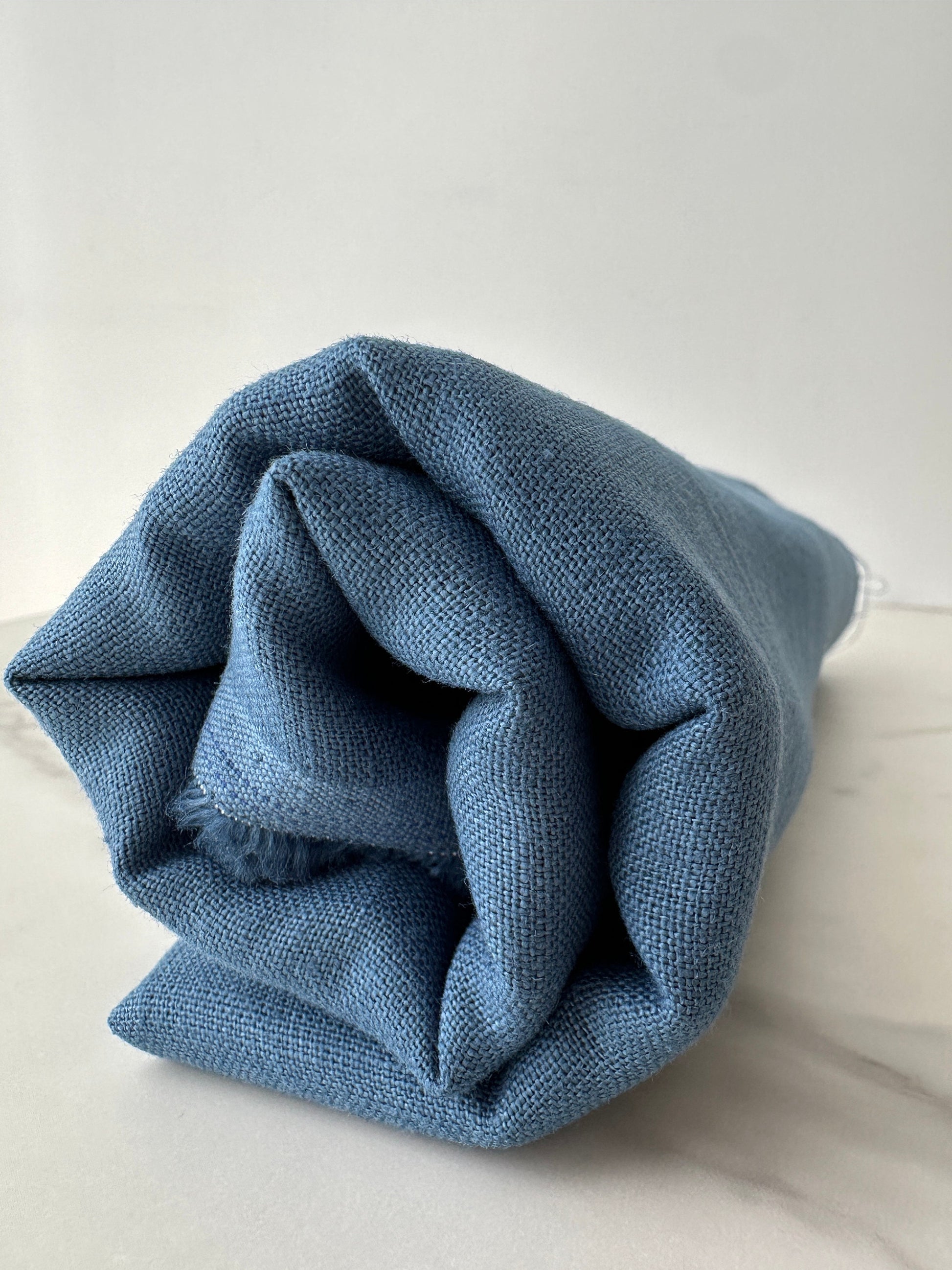 aegean blue linen fabric close up woven texture detail