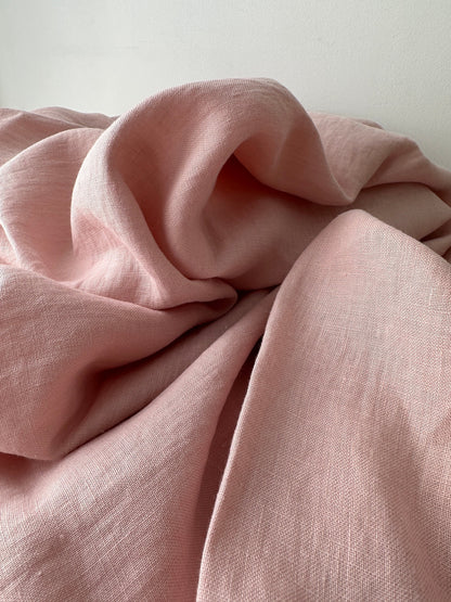 blush pink linen fabric detail showing slub and weave texture