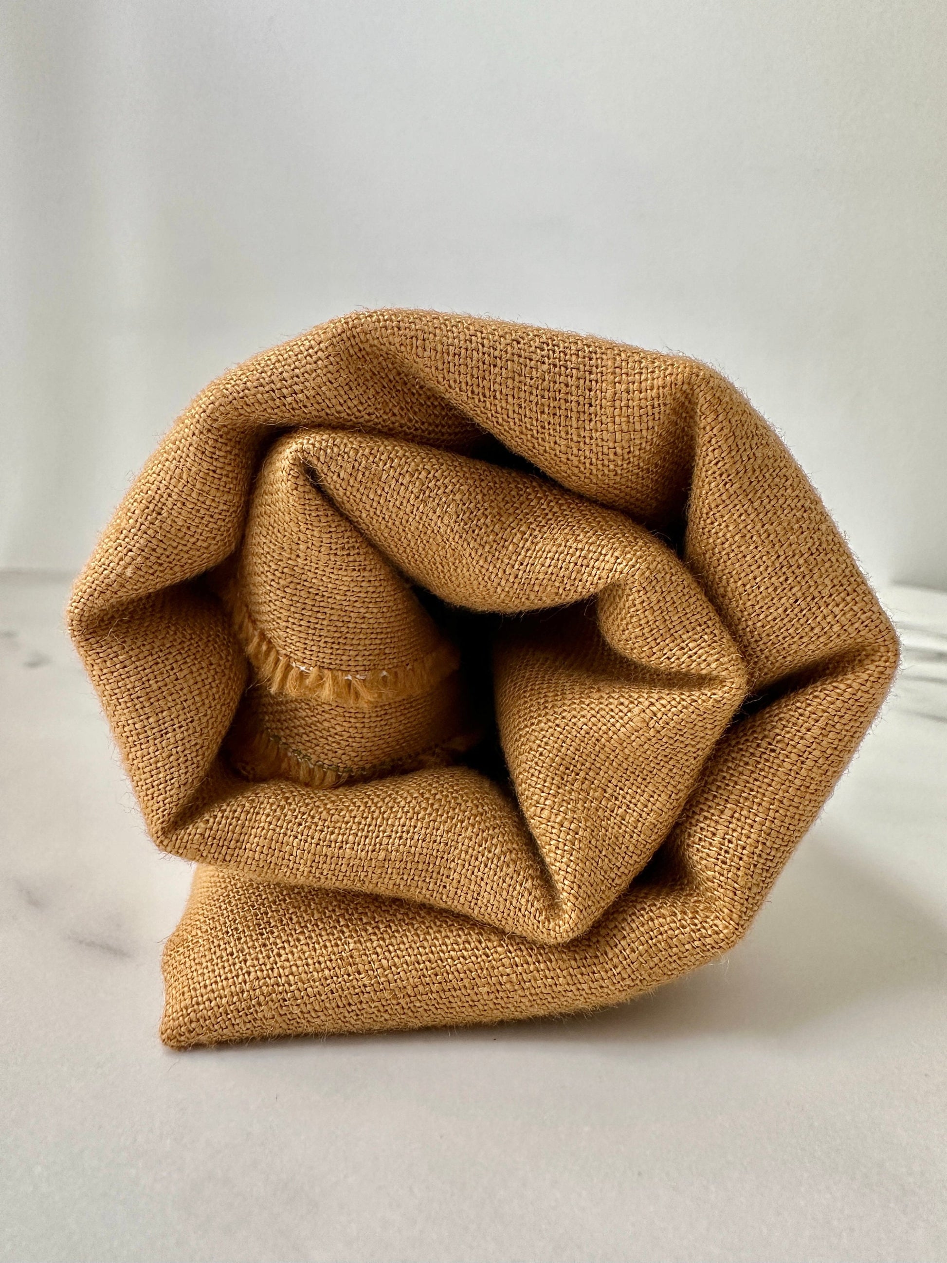 calm soft toffee brown linen fabric for texture and detail reference.