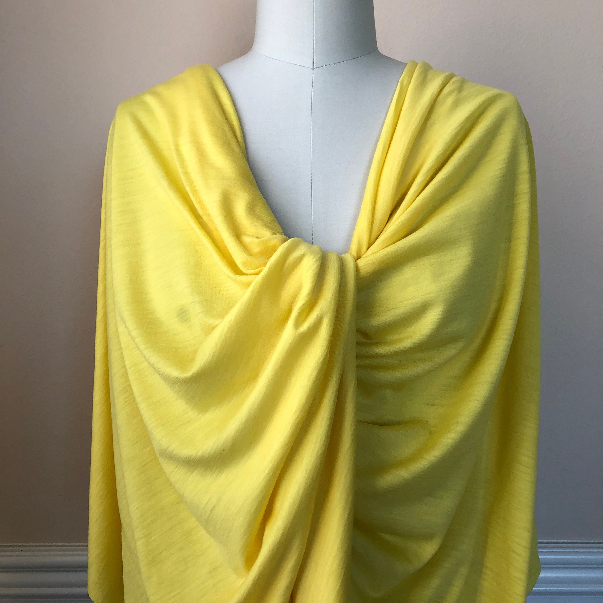 Luxurious lightweight merino wool jersey fabric in yellow.