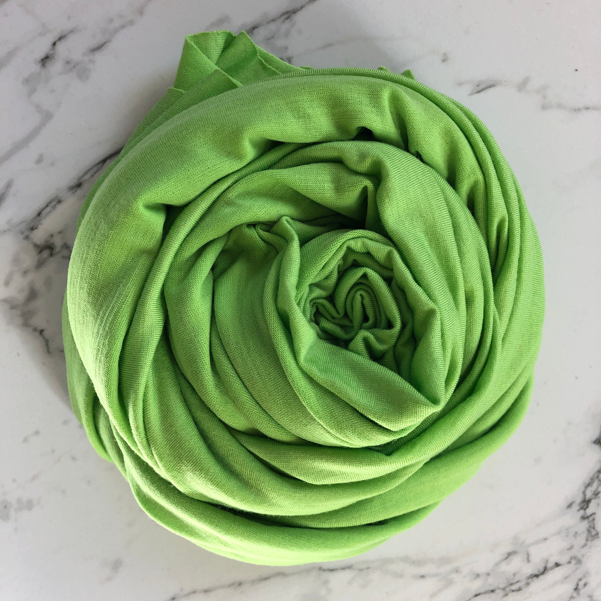 Bright green apple color merino wool fabric.