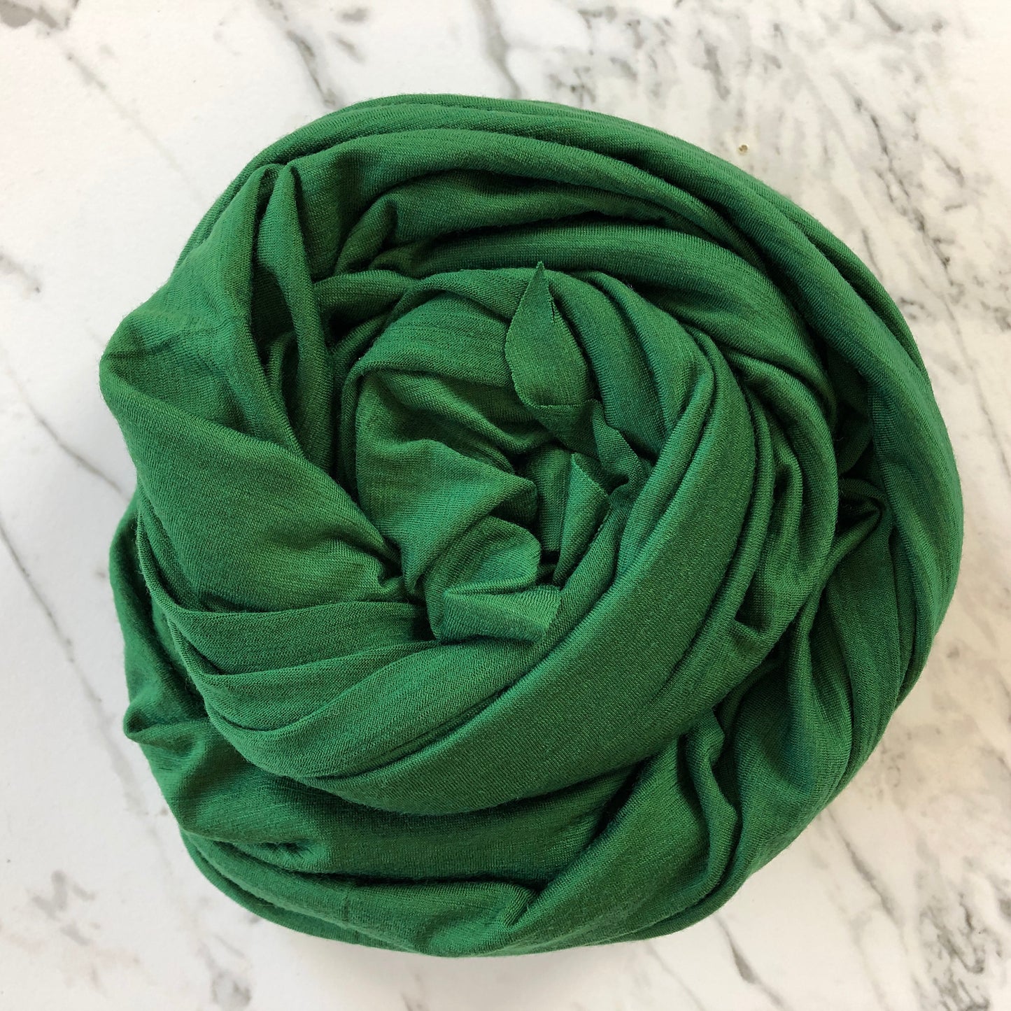 Green color stretch merino wool jersey fabric.