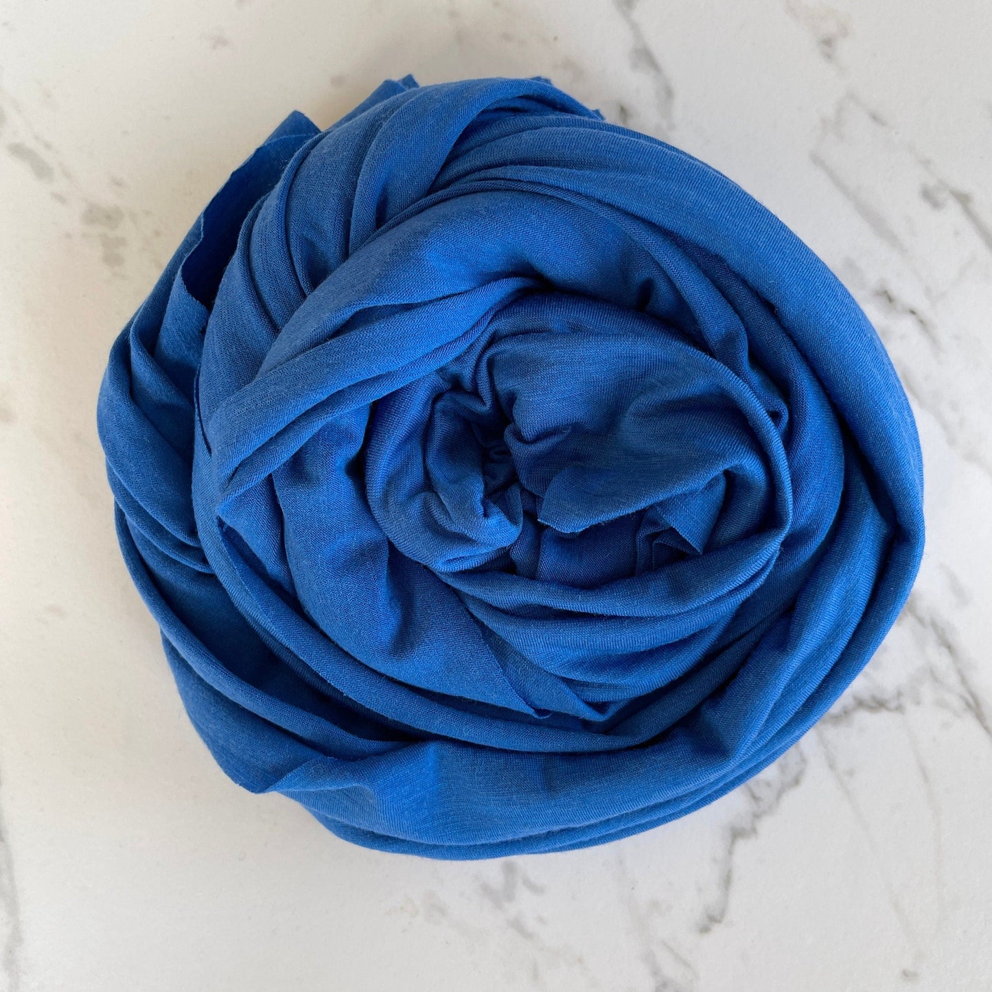 Versatile blue merino wool fabric suitable for various activities.