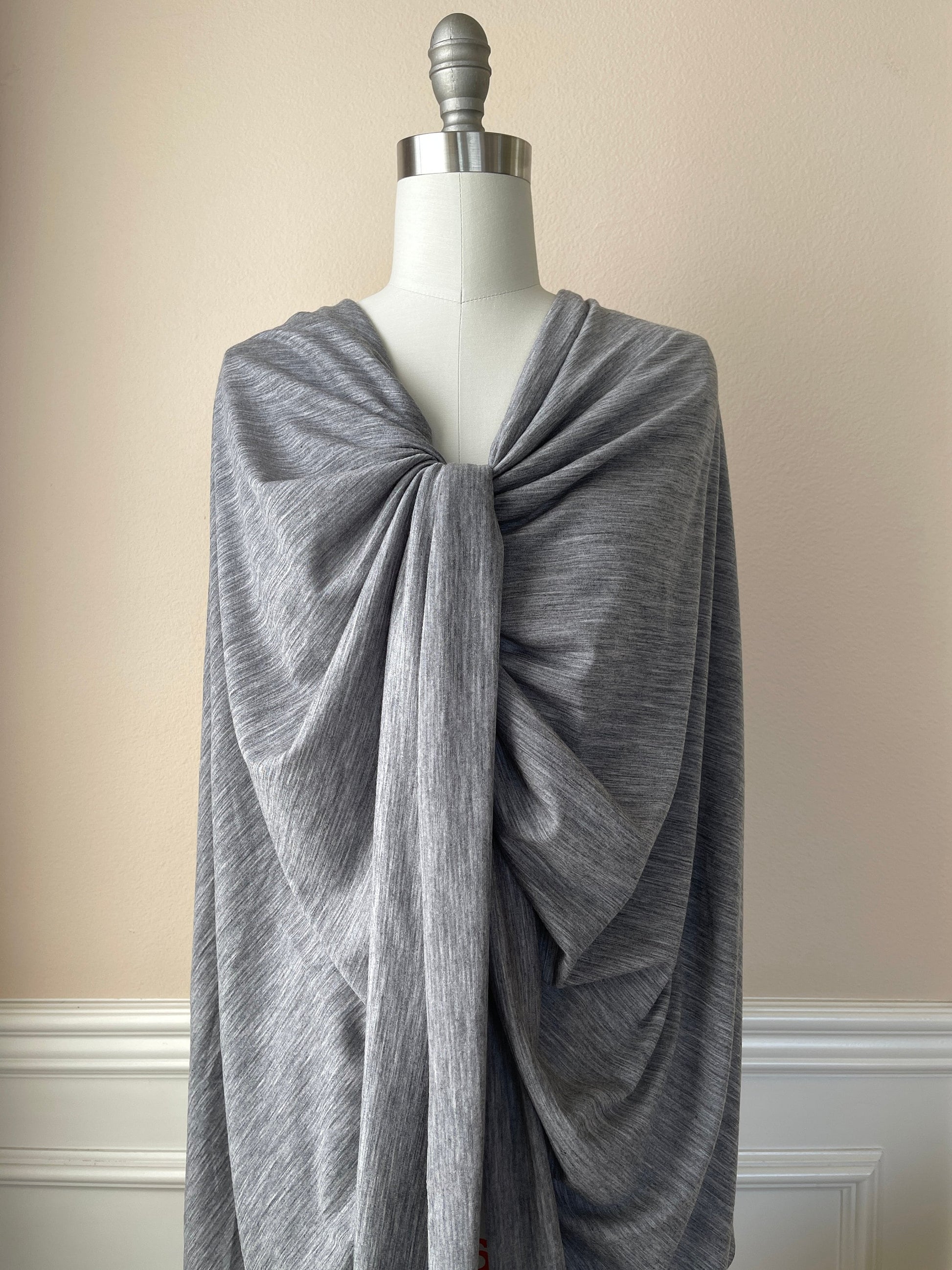 Merino wool fabric wrapped on female mannequin.