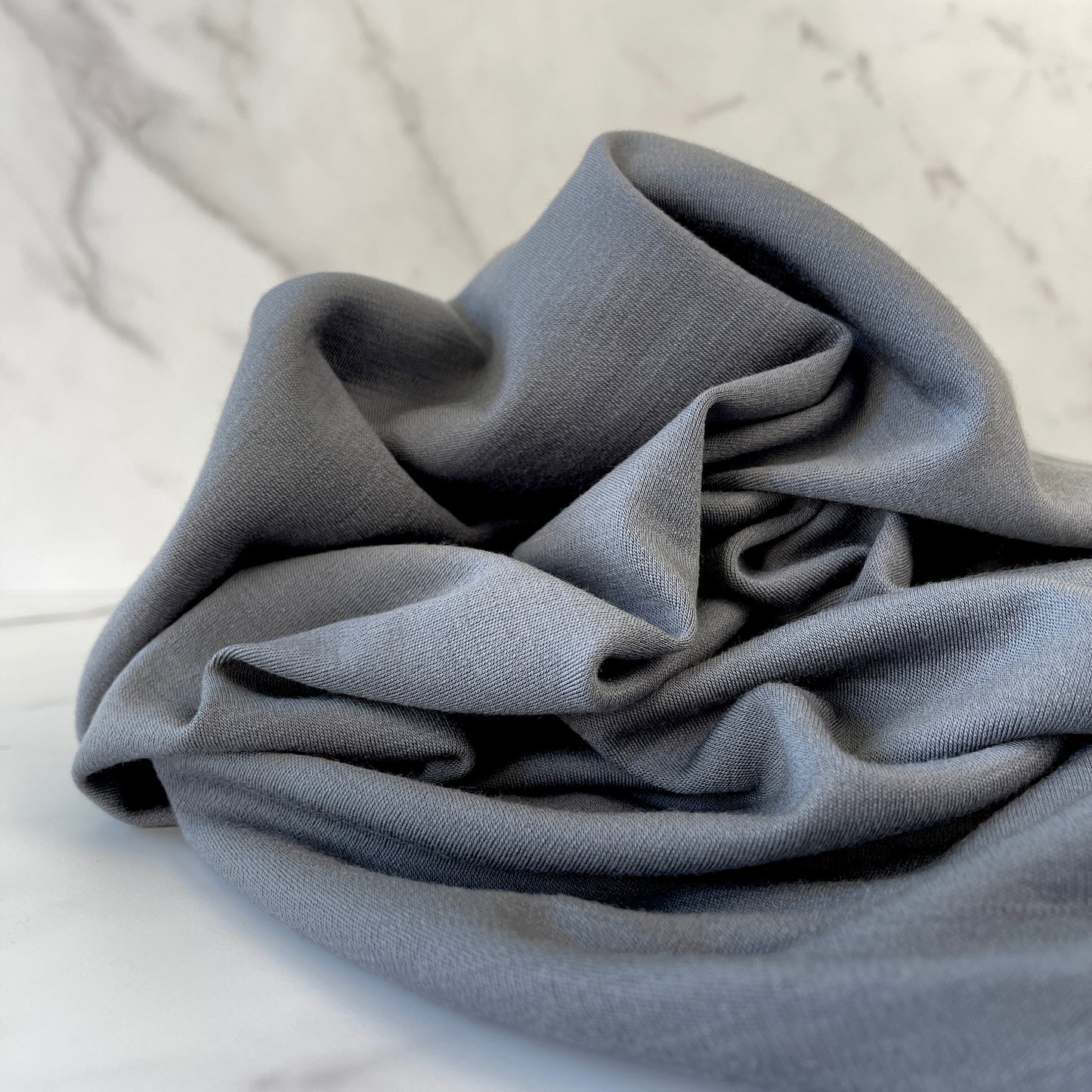 Breathable merino wool fabric for cool, airy wear.