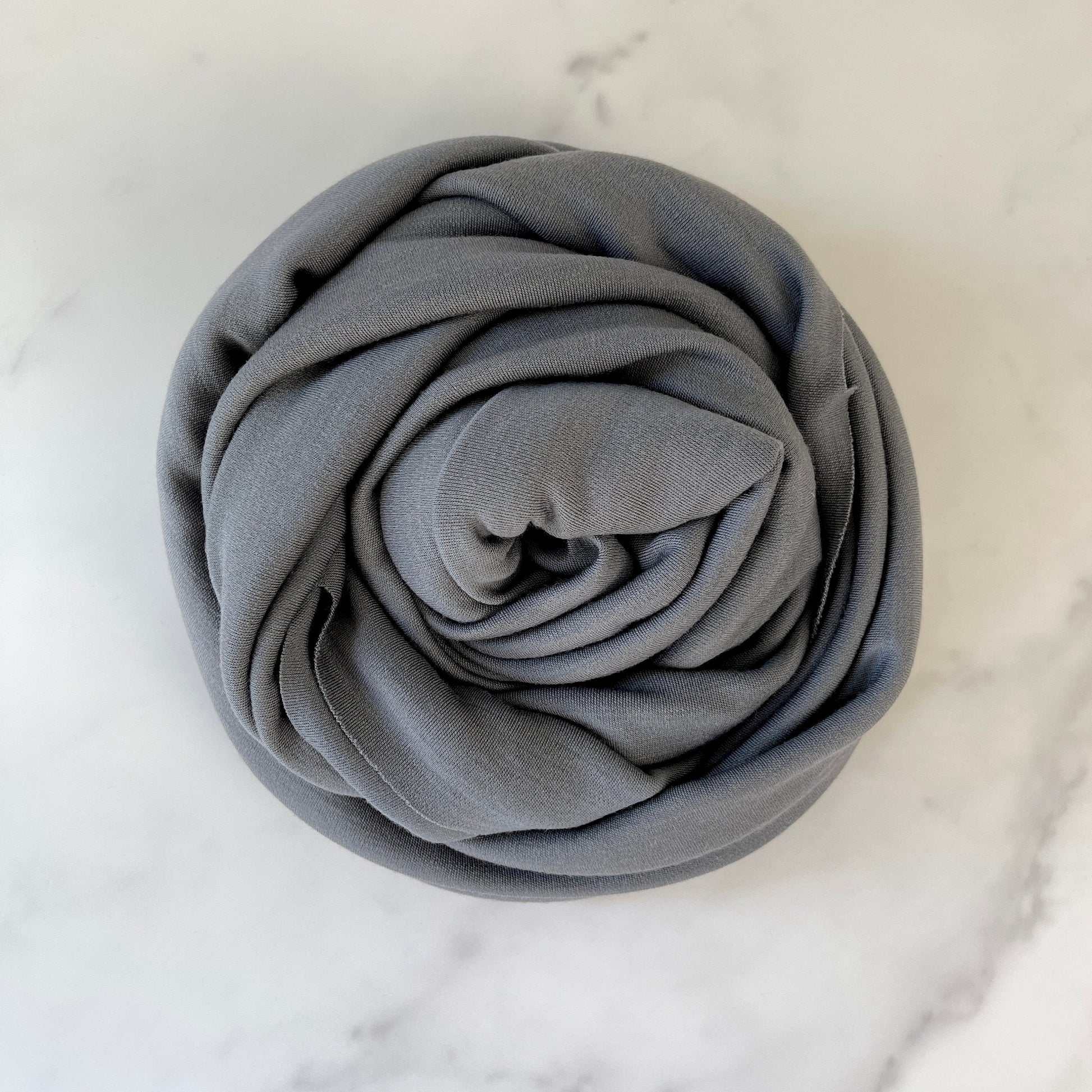 Soft merino wool fabric on gray color for cozy comfort