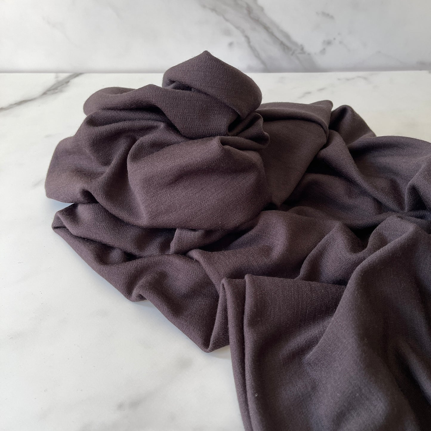 Temperature-regulating merino wool in brown color.