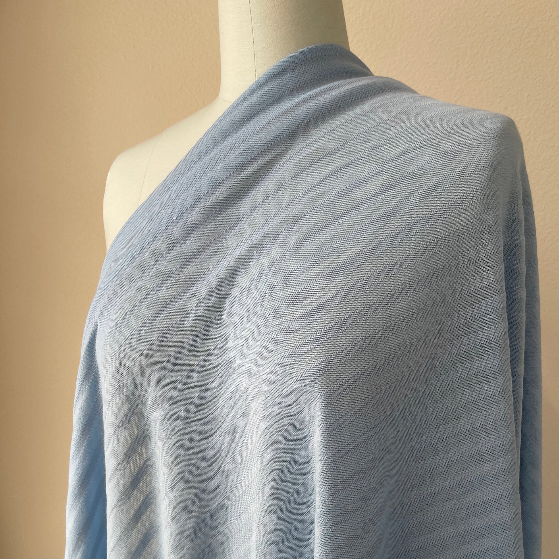 Comfortable merino wool stripe jersey fabric for travel outfits.