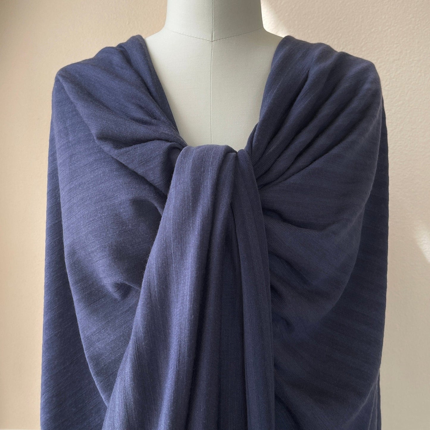 Dark blue merino wool stripe jersey on dress form.