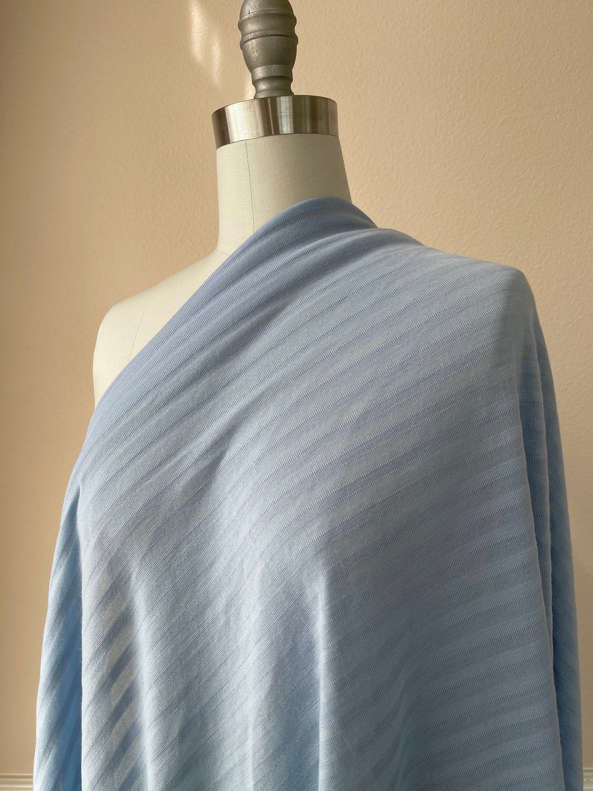 Versatile merino wool stripe jersey fabric for layering pieces.