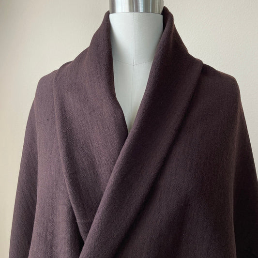 Merino wool fabric with high elasticity in warm brown color.