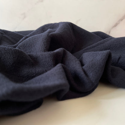 Heavyweight compressive merino wool fabric for athletic wear.