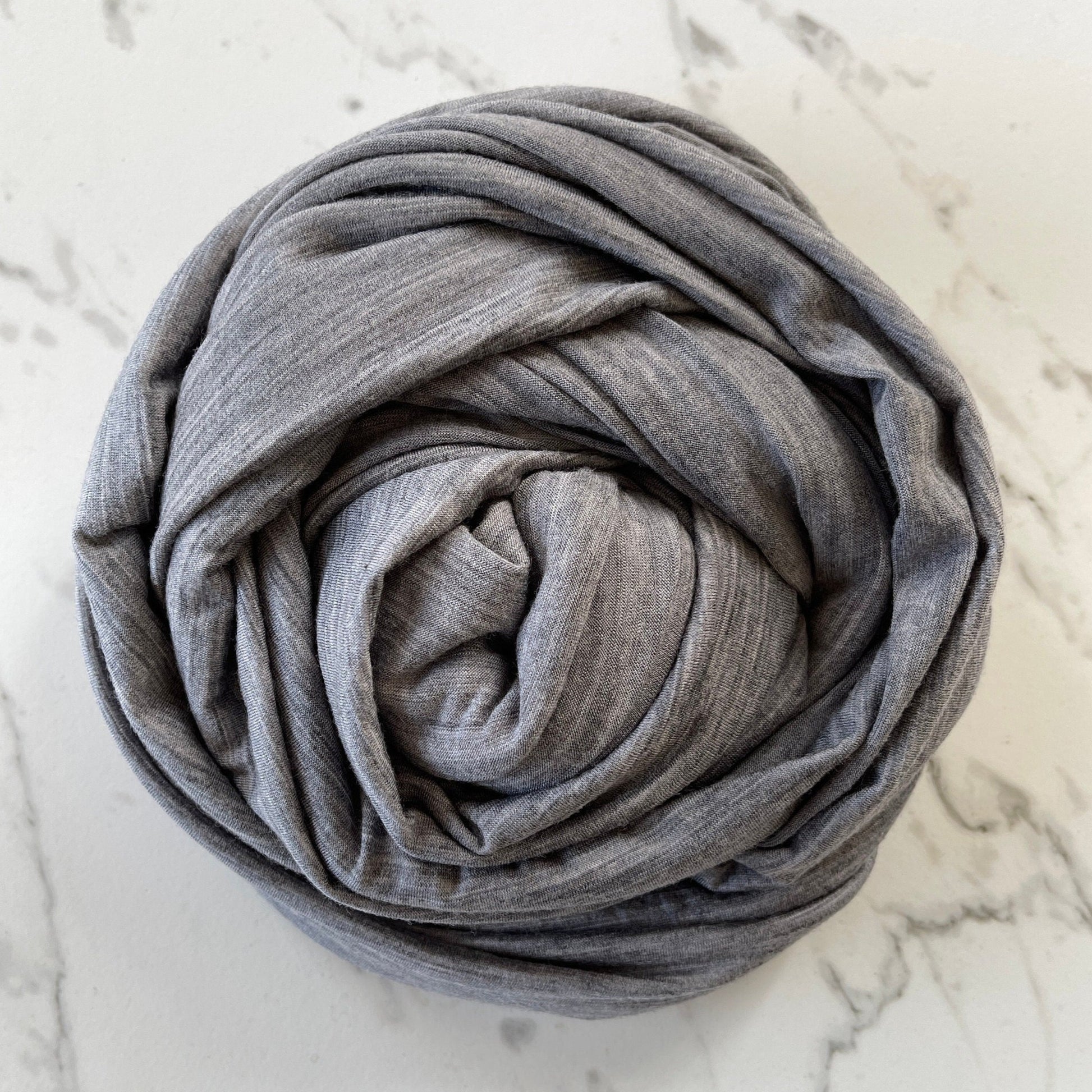 Gender neutral heather effect gray merino wool fabric.