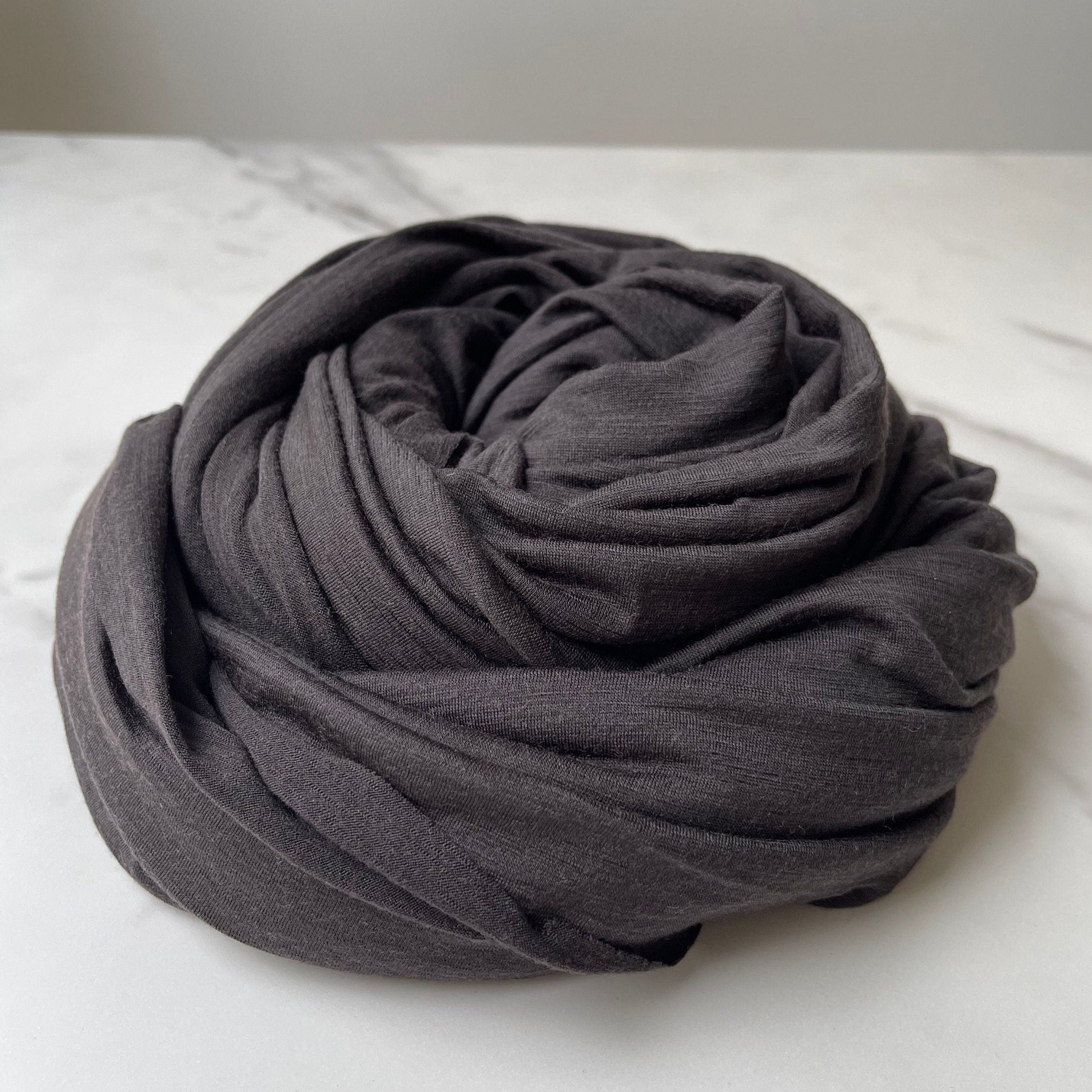 Lightweight merino wool stretch fabric sold by the yard.