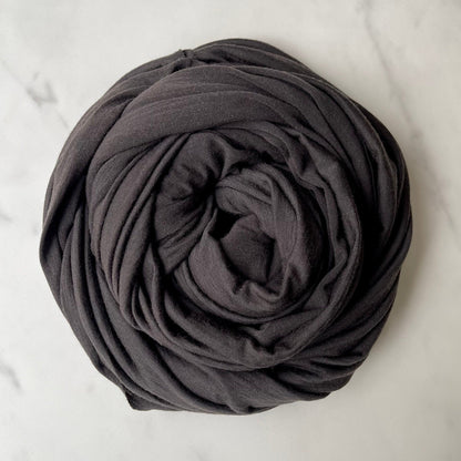 Machine washable merino wool in dark charred color.