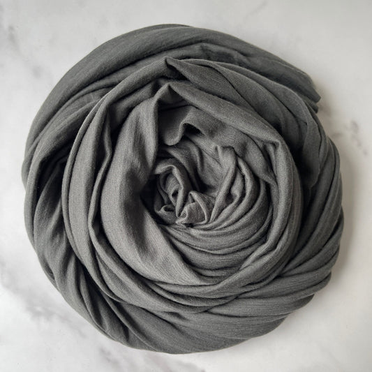 Gender neutral Rock Gray color merino wool fabric.