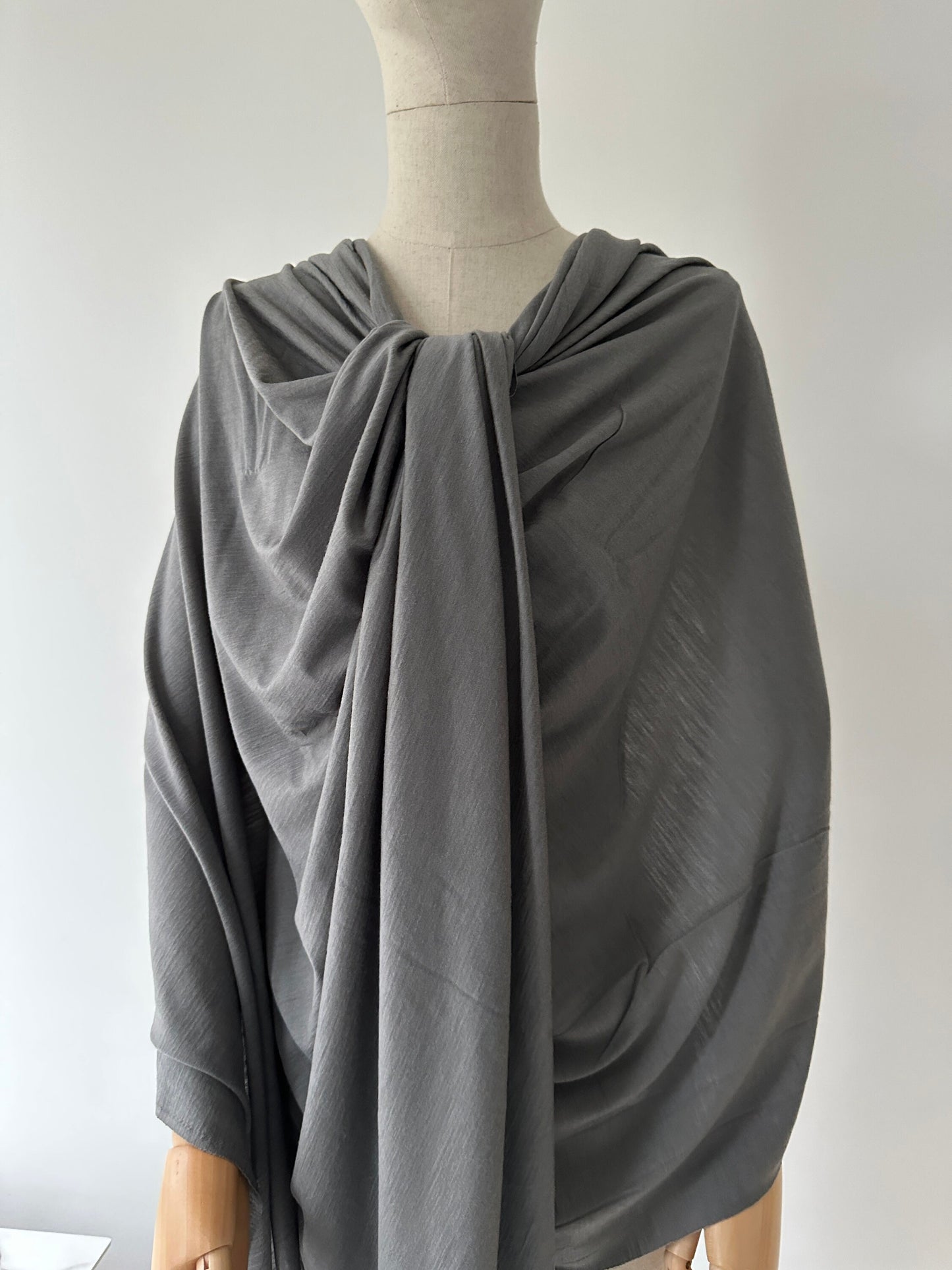 Merino wool fabric draped as women's gown.