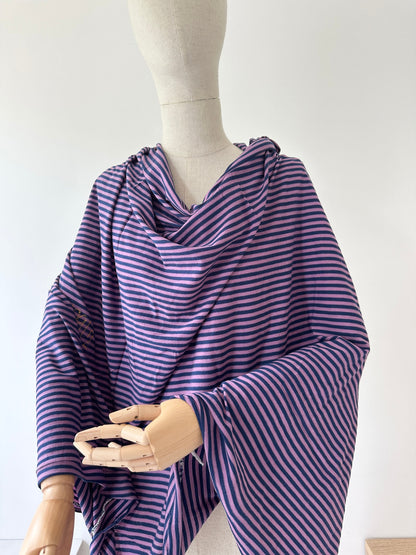 Yarn dyed merino wool stripe fabric in purple and navy blue.