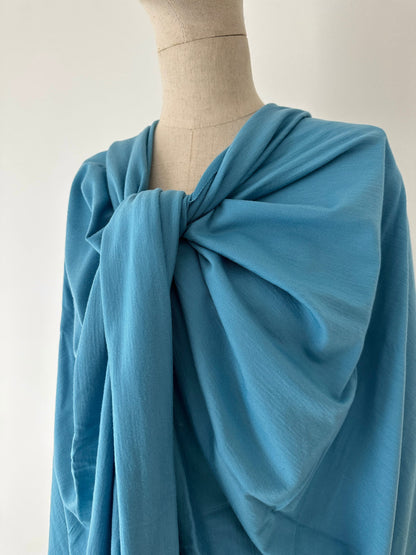 Easy-care merino wool fabric in blue color.