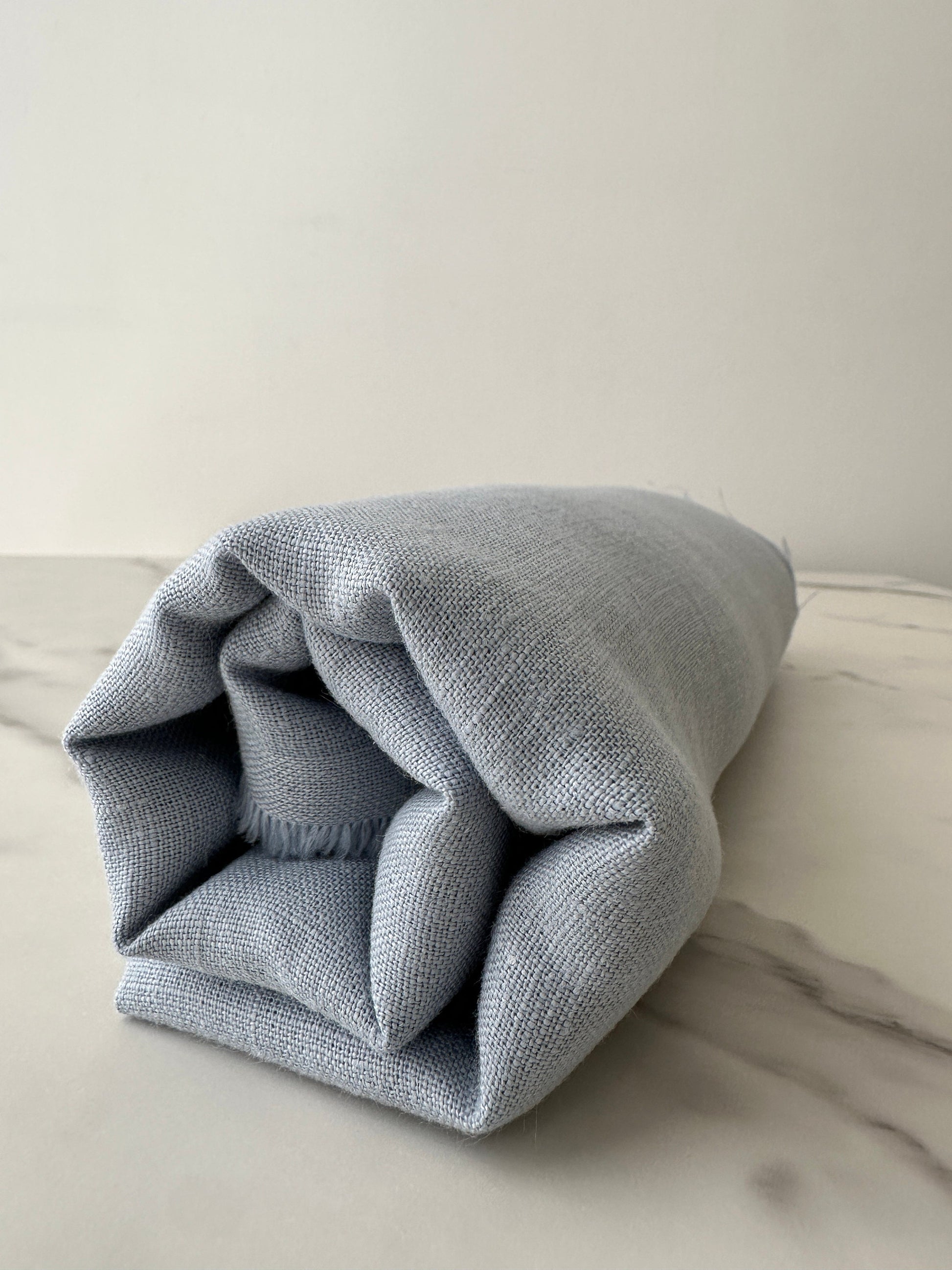 light blue linen fabric close up airy woven texture detail