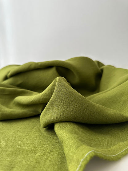 olive green linen fabric slub texture close up