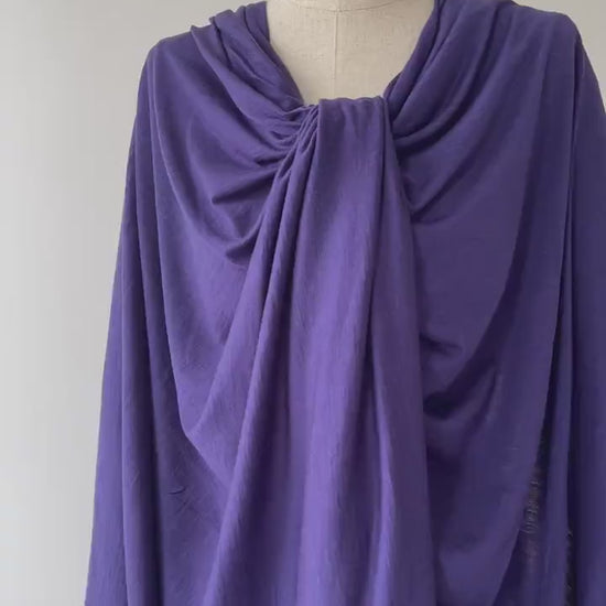 A video showing  blue color merino wool on dress form.