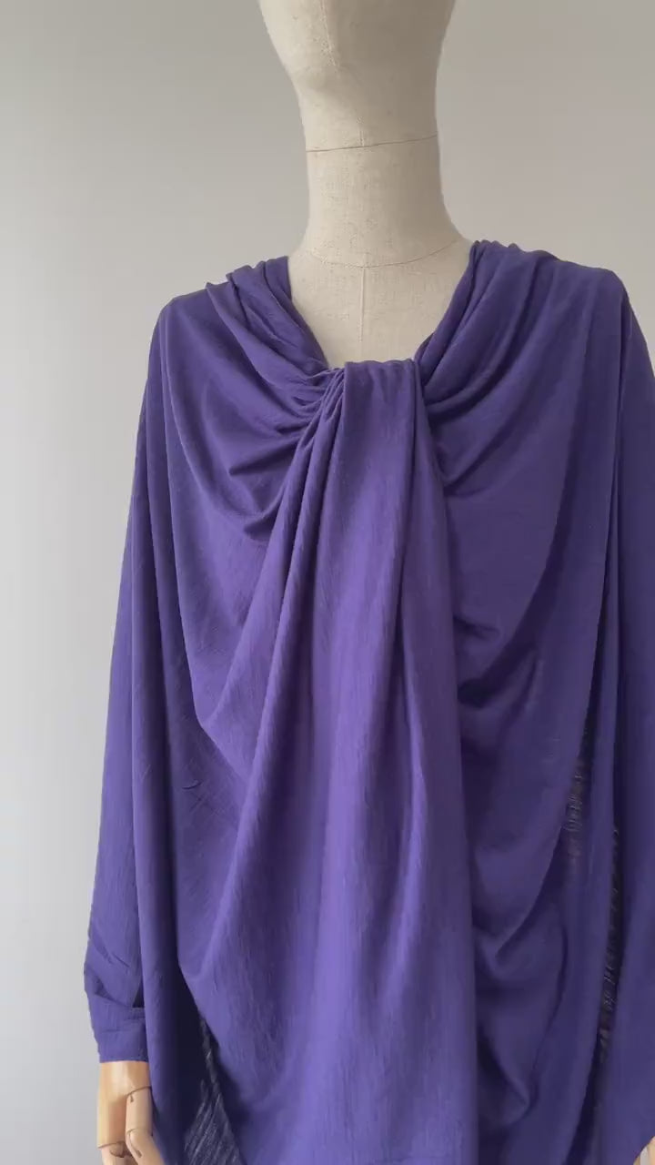 A video showing  blue color merino wool on dress form.