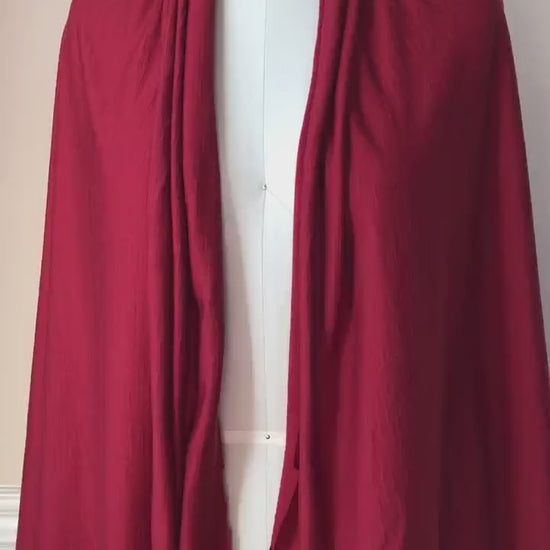 Video capturing classic red color merino wool fabric.