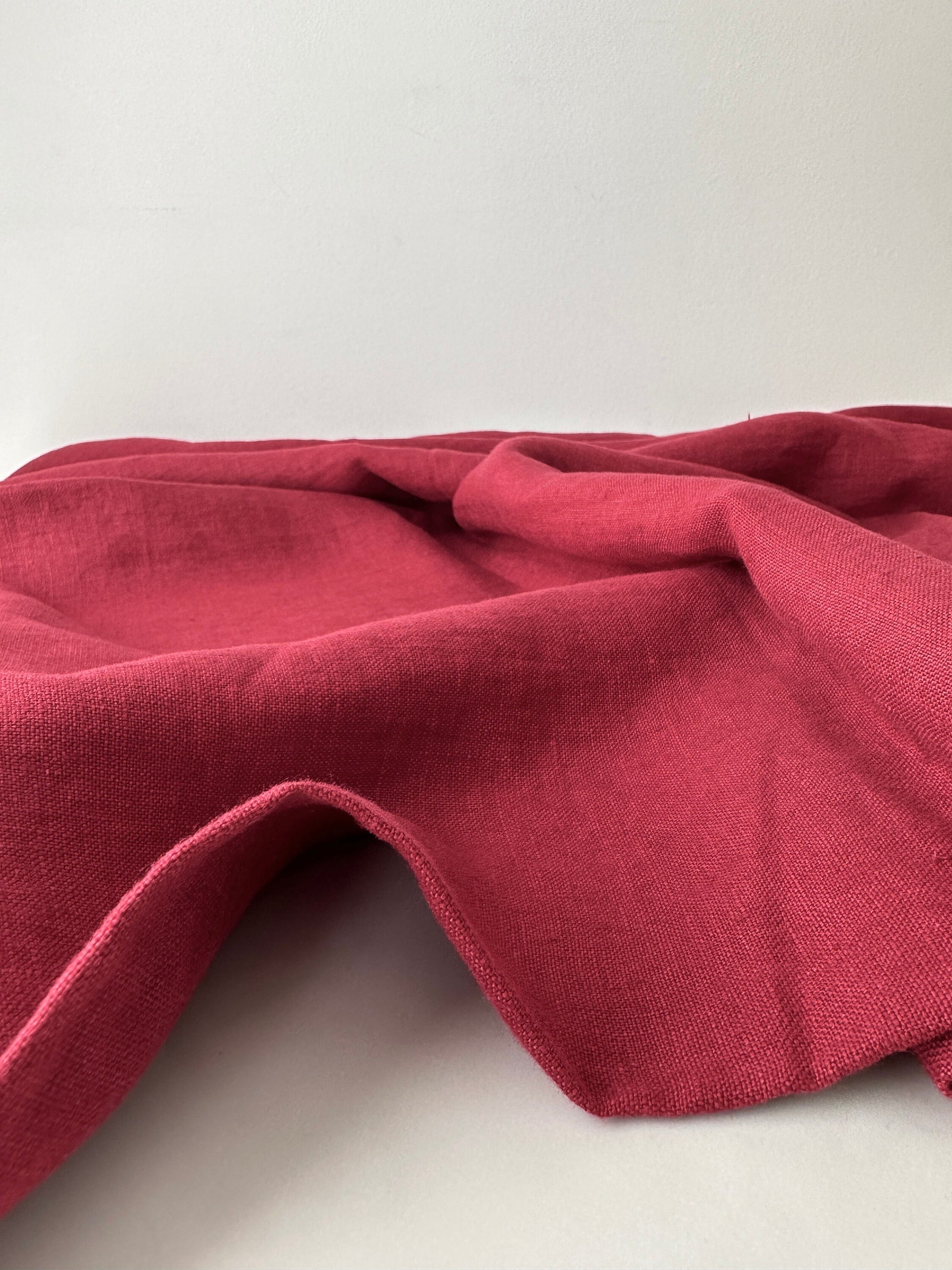 red garnet linen fabric side view showing colro depth