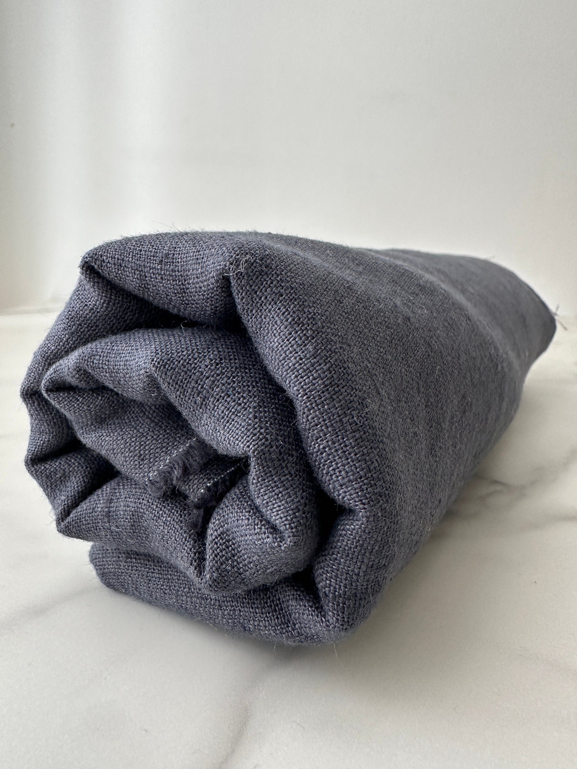 side view of smoke gray linen fabric by the yard