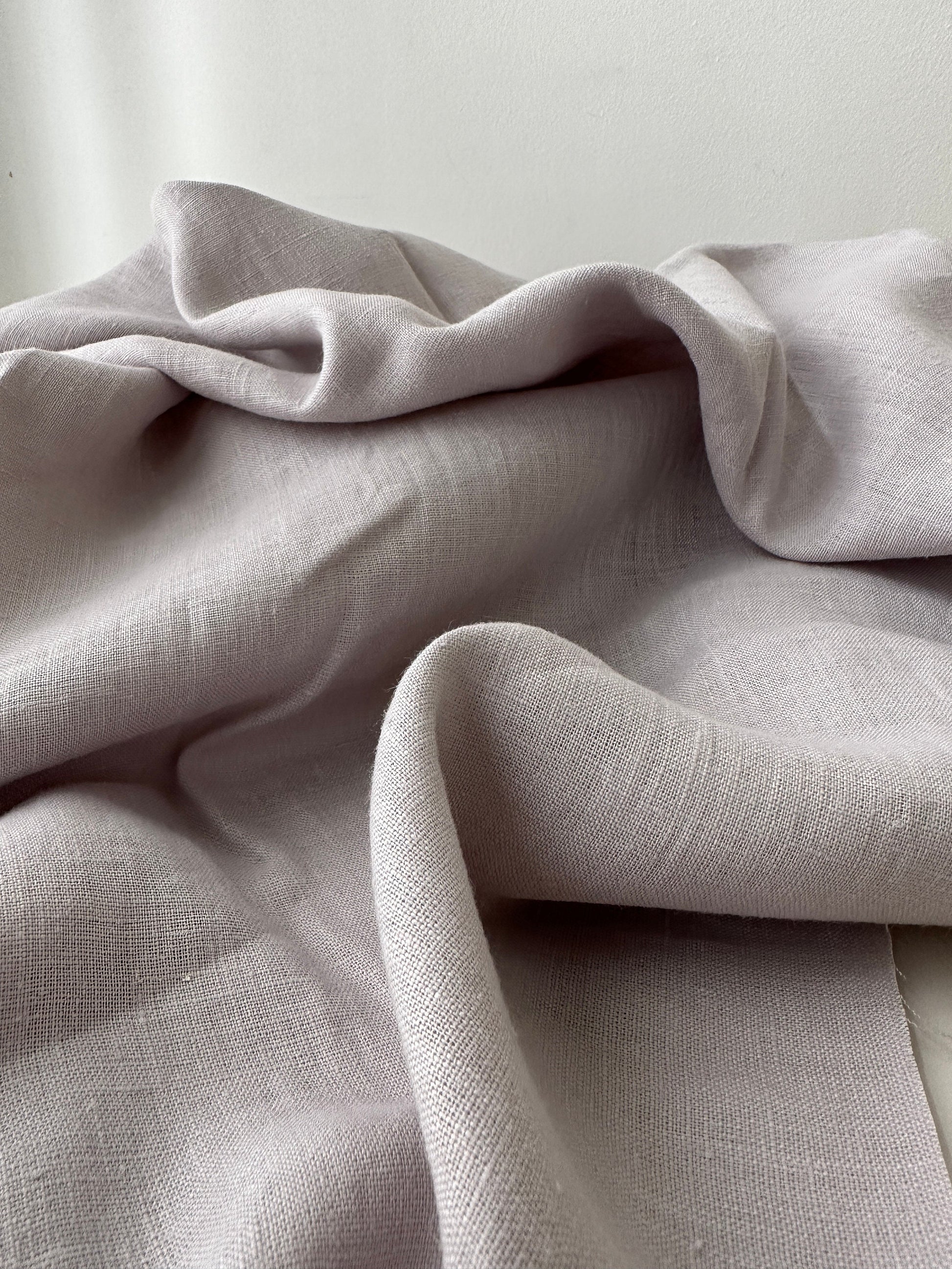 dove gray linen fabric folded to show color depth